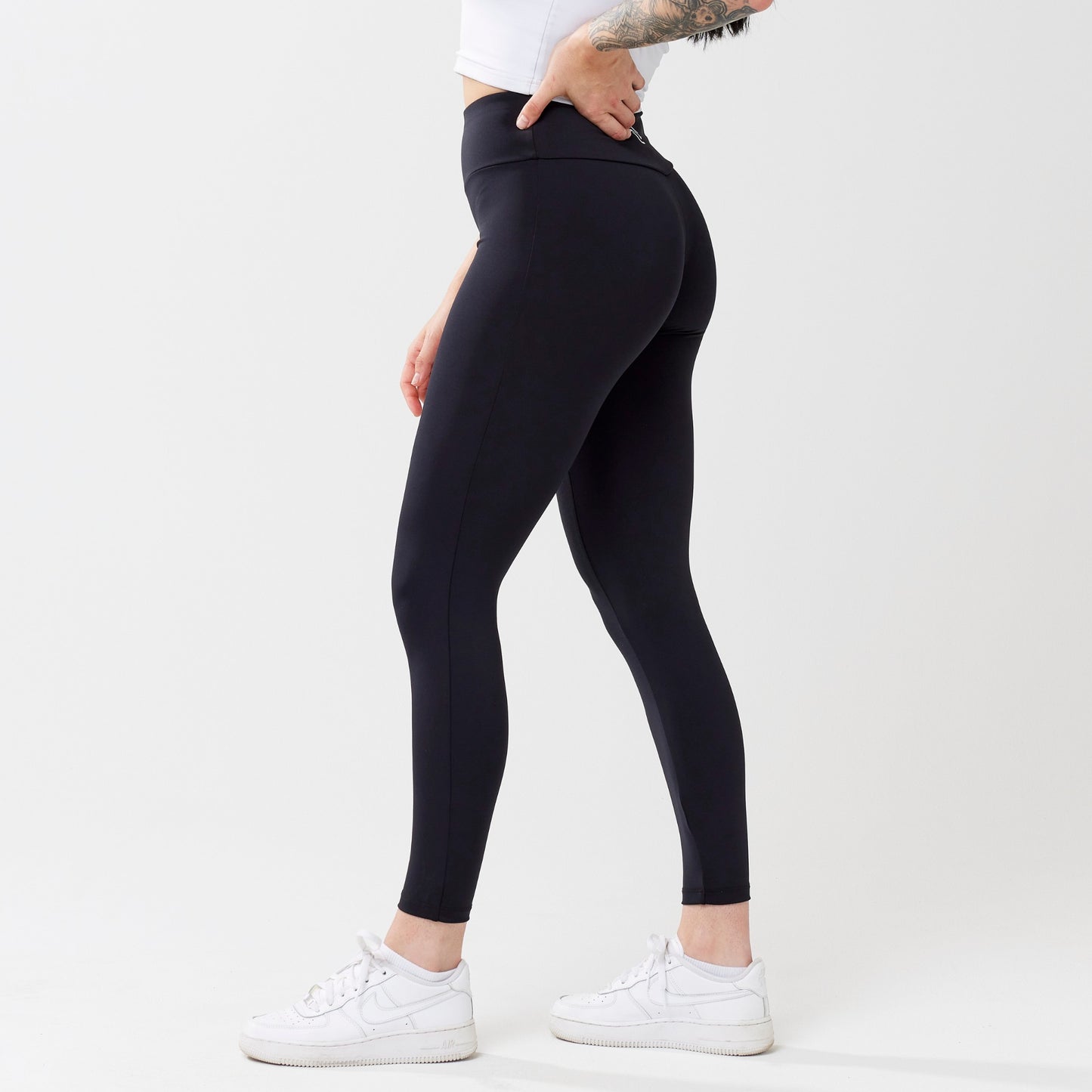 Model wearing black leggings for use in active lifestyles as well as casual living.