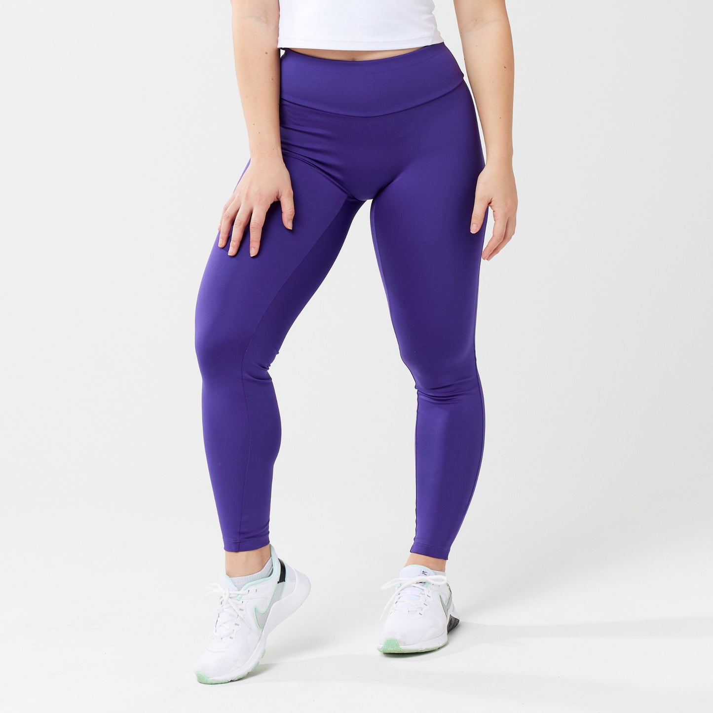 Model wearing indigo leggings for use in active lifestyles as well as casual living.