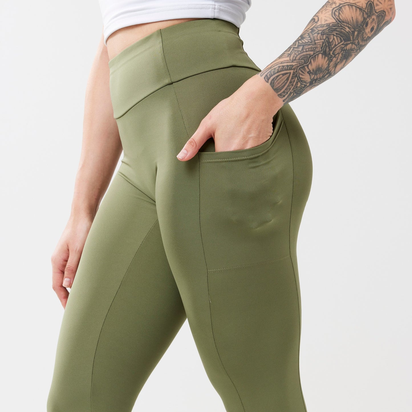 Model wearing sagewood leggings for use in active lifestyles as well as casual living.